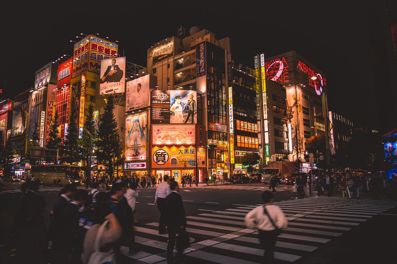 Neon-lit street crossing in Tokyo, Japan at night
