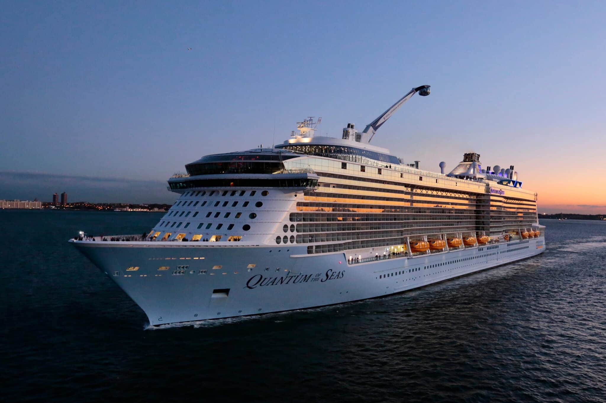 Quantum of the Seas cruise ship departing at dusk